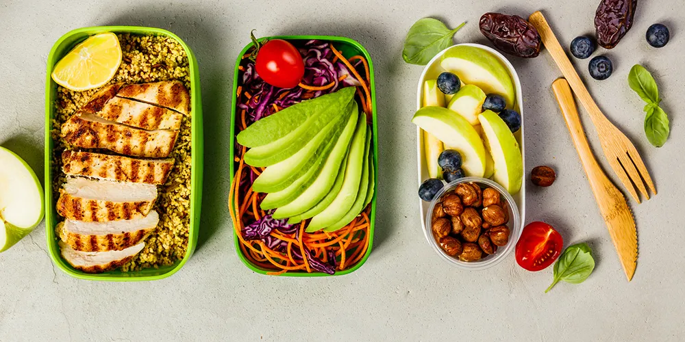 Printed nutrition reference cards beside a smartphone